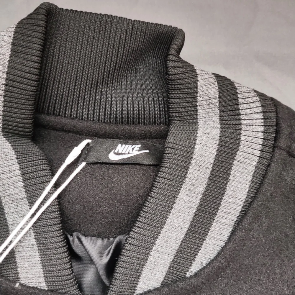 Nike Black Varsity Jacket with Mint Accents